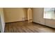 Spacious living room with wood flooring and good natural light at 2013 Meredith Dr, Spring Hill, FL 34608