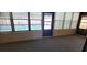 Bright sunroom with multiple windows offering a view of the outdoor pool at 2013 Meredith Dr, Spring Hill, FL 34608