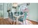 Elegant dining room with a stylish chandelier, arched windows, and comfortable seating for six at 2334 Gimlet, Spring Hill, FL 34608
