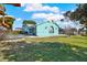 Charming home with a well-maintained lawn, unique architectural details, and a sunny curb appeal at 2334 Gimlet, Spring Hill, FL 34608