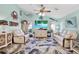 Spacious living room with a coastal theme, featuring dual recliners and a plush sofa for comfortable living at 2334 Gimlet, Spring Hill, FL 34608