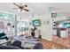 Inviting living area connects to dining and kitchen, showcasing an open concept with modern finishes at 2334 Gimlet, Spring Hill, FL 34608