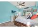 Bright and airy main bedroom with coastal decor, ceiling fan, and outdoor access at 2334 Gimlet, Spring Hill, FL 34608