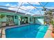 Private screened-in pool with inviting turquoise water and a spacious patio at 2334 Gimlet, Spring Hill, FL 34608