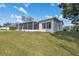 Back exterior view of home with screened lanai at 2862 Lomond Dr, Palm Harbor, FL 34684