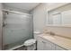 Bright bathroom features a glass enclosed shower and modern vanity at 2862 Lomond Dr, Palm Harbor, FL 34684
