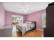Cozy bedroom with hardwood floors and a connecting room at 2862 Lomond Dr, Palm Harbor, FL 34684