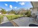 Welcoming patio area with comfortable seating, overlooking the front lawn and the surrounding neighborhood at 2862 Lomond Dr, Palm Harbor, FL 34684