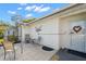 Charming home with a cozy patio area and inviting front entrance, surrounded by lush greenery at 2862 Lomond Dr, Palm Harbor, FL 34684