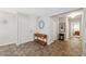 Inviting foyer with tile flooring, a decorative mirror, and a view into the home's interior at 2862 Lomond Dr, Palm Harbor, FL 34684