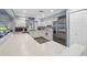 Kitchen with stainless steel appliances, white cabinets, and a seamless transition to the living spaces at 2862 Lomond Dr, Palm Harbor, FL 34684