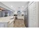 Bright and airy kitchen with stainless steel appliances, white cabinets, and a view to the living room at 2862 Lomond Dr, Palm Harbor, FL 34684