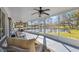 Large screened lanai offers views of the pond at 2862 Lomond Dr, Palm Harbor, FL 34684