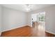 Bright living room with hardwood floors leading to sunroom with lake view at 2862 Lomond Dr, Palm Harbor, FL 34684