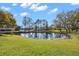 Scenic view of pond surrounded by lush greenery at 2862 Lomond Dr, Palm Harbor, FL 34684
