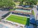 An aerial view of shuffleboard courts featuring benches and shade covers for community players at 2862 Lomond Dr, Palm Harbor, FL 34684