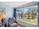 Bright sun room has a great view of the pond at 2862 Lomond Dr, Palm Harbor, FL 34684