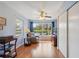Relaxing sun room with a large window overlooking a serene pond and nature views at 2862 Lomond Dr, Palm Harbor, FL 34684