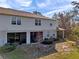 Townhome backyard featuring a screened patio, well-maintained lawn, and serene views for outdoor enjoyment and relaxation at 2907 Jacob Crossing Ln, Holiday, FL 34691