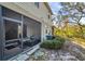 View of patio with screen and seating, with view to yard at 2907 Jacob Crossing Ln, Holiday, FL 34691