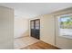 Inviting entryway with black paneled front door, tile flooring, and natural light from a window at 3736 Sail Dr, New Port Richey, FL 34652