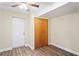 Basement room with wood-look floors, a closet, and an exit door at 3736 Sail Dr, New Port Richey, FL 34652