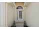 Inviting entryway with an arched window above the door at 456 Greenwich Cir, Spring Hill, FL 34609