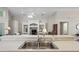 The kitchen has stainless steel sink overlooking the living area with built-in shelving at 456 Greenwich Cir, Spring Hill, FL 34609