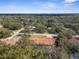 Charming single-story home with screened pool is surrounded by mature trees in a lush community at 4603 Lake In The Woods Dr, Spring Hill, FL 34607