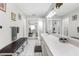 Expansive bathroom with dual sinks, long vanity, bench seating and ample space for luxurious comfort at 4603 Lake In The Woods Dr, Spring Hill, FL 34607