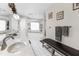 Spacious bathroom featuring double sinks, relaxing tub, and comfortable bench, creating a serene retreat at 4603 Lake In The Woods Dr, Spring Hill, FL 34607
