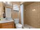 Bathroom with a toilet, shower with curtain, linoleum flooring, and a sink with a wood cabinet at 4603 Lake In The Woods Dr, Spring Hill, FL 34607