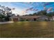 Lovely single-story home with a well-manicured front yard at 4603 Lake In The Woods Dr, Spring Hill, FL 34607