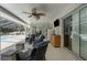 Relaxing outdoor patio with ceiling fan and wet bar with views to pool area at 4603 Lake In The Woods Dr, Spring Hill, FL 34607