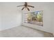 Bedroom featuring a ceiling fan and a large window at 4929 Avery Rd, New Port Richey, FL 34652