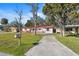 Charming single-story home with red tile roof, wooden fence, and well-kept front yard at 4929 Avery Rd, New Port Richey, FL 34652