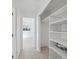 Bright hallway featuring ceramic tile floors and a closet at 4929 Avery Rd, New Port Richey, FL 34652