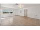 Bright, airy living room with tiled floors and ample natural light at 4929 Avery Rd, New Port Richey, FL 34652