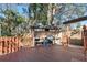 Outdoor kitchen with a built-in grill and counter space on a wooden deck at 4929 Avery Rd, New Port Richey, FL 34652
