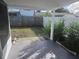 Covered backyard patio area featuring a stone surface and a partial view of the lawn at 5026 Manor Dr, New Port Richey, FL 34652