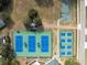 Aerial view showcasing tennis and basketball courts, as well as playground amenities available in the community at 5351 Championship Cup Ln, Spring Hill, FL 34609
