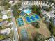 An aerial view of community amenities that includes tennis courts, basketball court, and pool at 5351 Championship Cup Ln, Spring Hill, FL 34609
