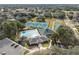 An aerial view of the community recreation center showing tennis courts, swimming pool, and clubhouse at 5351 Championship Cup Ln, Spring Hill, FL 34609