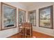 Charming bar area with hardwood floors, wooden chairs, and views of the pool and backyard at 5351 Championship Cup Ln, Spring Hill, FL 34609