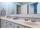 Well-lit bathroom with double sinks and a white vanity, providing a clean and modern aesthetic at 5351 Championship Cup Ln, Spring Hill, FL 34609