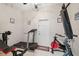 Exercise room featuring a treadmill, bike and bench press for in-home workouts at 5351 Championship Cup Ln, Spring Hill, FL 34609