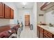 Functional laundry room includes side by side washer and dryer and plenty of storage at 5351 Championship Cup Ln, Spring Hill, FL 34609