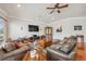 Comfortable living room with wood floors, recessed lights, and comfortable furniture at 5351 Championship Cup Ln, Spring Hill, FL 34609