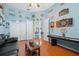 Spacious living room featuring a shuffleboard table, with easy access to the adjacent pool room and ample closet space at 5351 Championship Cup Ln, Spring Hill, FL 34609