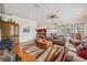 Open floorplan with an inviting living room featuring wood floors and natural light at 5351 Championship Cup Ln, Spring Hill, FL 34609